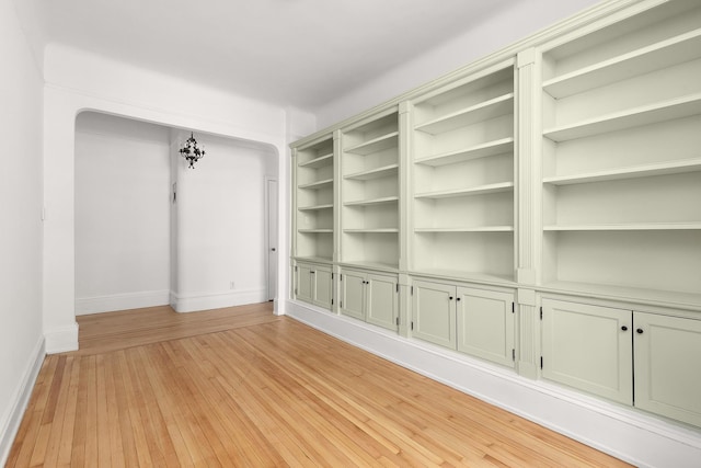 615 W 113th St Unit 6, New York City, NY 10025 - unfurnished room featuring light wood-style flooring and arched walkways
