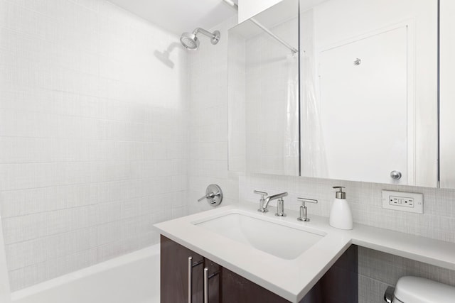 240 E 76th St Unit 3W, New York City, NY 10021 - bathroom featuring vanity, backsplash, and shower / bath combination with curtain