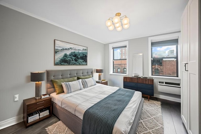 250 W 15th St Unit 6F, New York City, NY 10011 - bedroom featuring dark wood-style floors, a chandelier, and ornamental molding