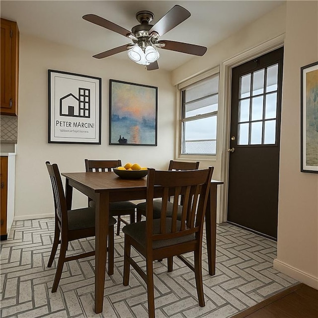 2475 W 16th St Unit 18-G, New York City, NY 11214 - dining room featuring ceiling fan and brick patterned floors