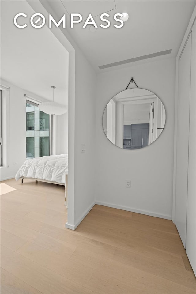 8 S 4th St Unit 15D, New York City, NY 11249 - empty room with light wood finished floors and baseboards