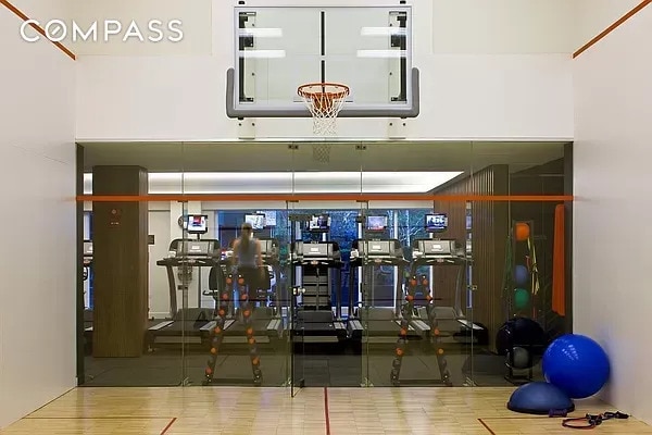 515 E 72nd St Unit 9J, New York City, NY 10021 - workout area featuring wood finished floors