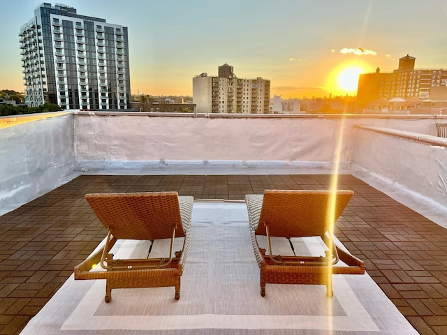 53-10 90th St Unit 4-B, New York City, NY 11373 - balcony at dusk featuring a view of city