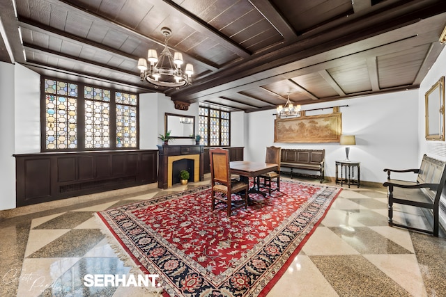 320 E 42nd St Unit 705, New York City, NY 10017 - living area featuring a chandelier and wood ceiling