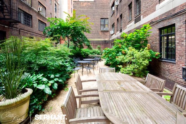 320 E 42nd St Unit 705, New York City, NY 10017 - wooden deck with outdoor dining area