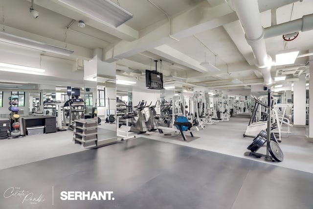 320 E 42nd St Unit 705, New York City, NY 10017 - exercise room with beam ceiling