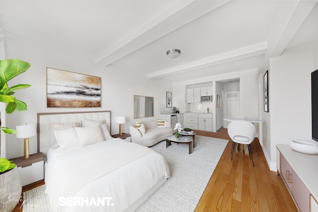 320 E 42nd St Unit 705, New York City, NY 10017 - bedroom featuring beamed ceiling and light wood-style floors