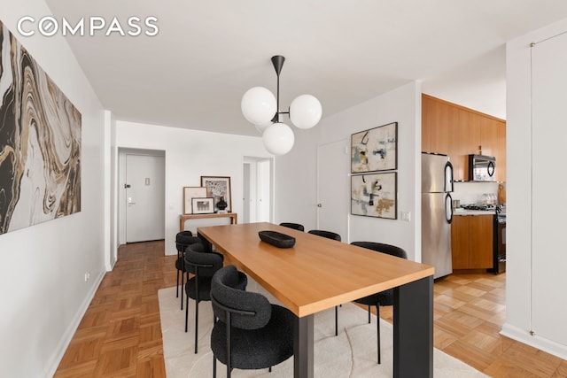 70 E 10th St Unit 15R, New York City, NY 10003 - dining room featuring baseboards