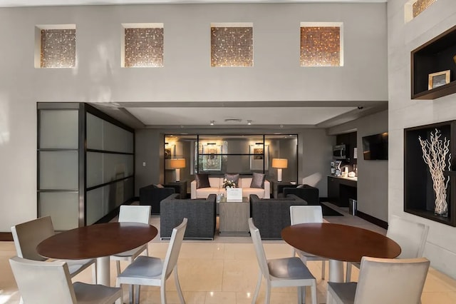 80 Riverside Blvd Unit 7-A, New York City, NY 10069 - dining space featuring a high ceiling and light tile patterned flooring