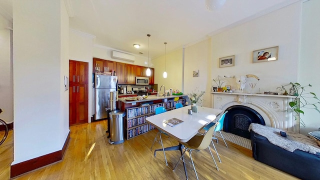 125 Washington Ave, New York City, NY 11205 - dining room with light wood-type flooring and a fireplace
