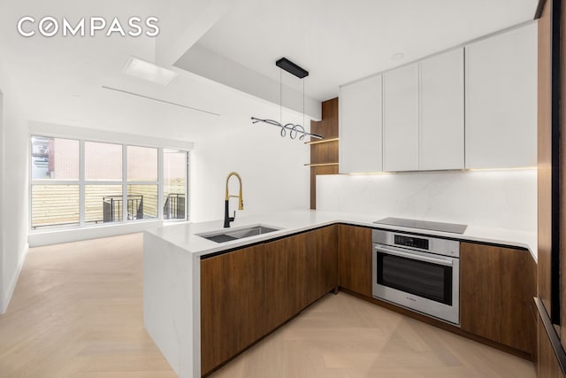 90 Herbert St Unit Th1, New York City, NY 11222 - kitchen featuring oven, modern cabinets, open shelves, white cabinets, and black electric stovetop