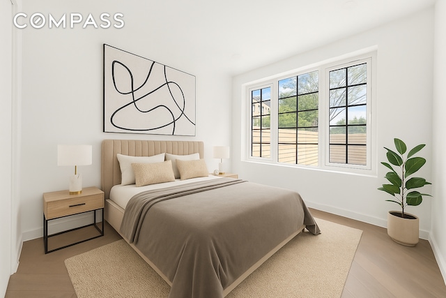 90 Herbert St Unit Th1, New York City, NY 11222 - bedroom with baseboards and wood finished floors