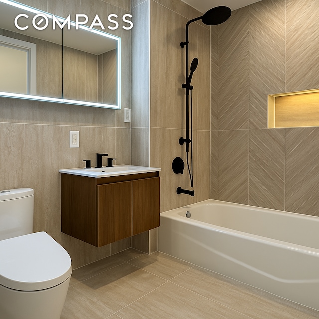 90 Herbert St Unit Th1, New York City, NY 11222 - full bath with tile patterned flooring, vanity, shower / bath combination, and tile walls