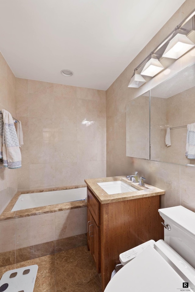 45 Park Ave Unit 1105, New York City, NY 10016 - full bath featuring tile walls, vanity, tiled bath, and tile patterned flooring