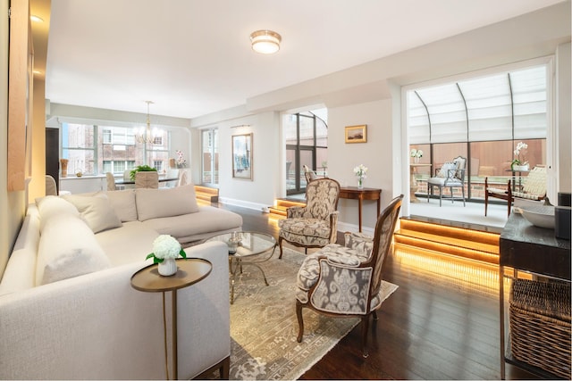 12 Beekman Pl Unit 11B, New York City, NY 10022 - living room featuring hardwood / wood-style flooring, a chandelier, and healthy amount of natural light