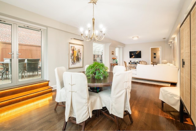 12 Beekman Pl Unit 11B, New York City, NY 10022 - dining area featuring a chandelier and dark wood-type flooring