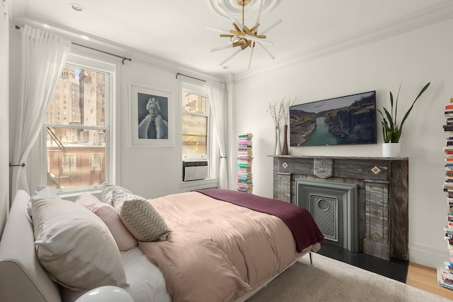 140 W 10th St Unit 3R, New York City, NY 10014 - bedroom with ornamental molding, multiple windows, a fireplace, and wood finished floors