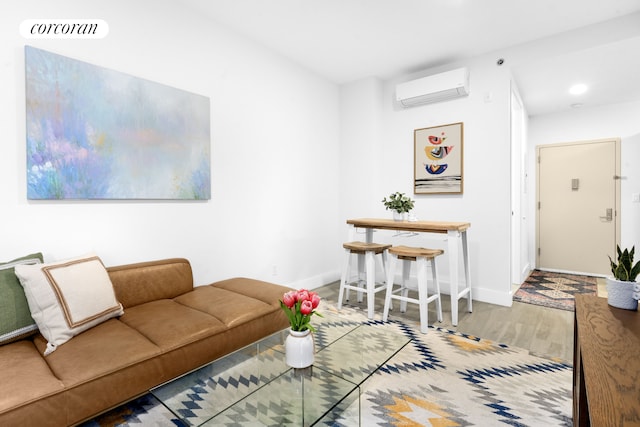 631 E 18th St Unit 2B, New York City, NY 11226 - living room with a wall unit AC, wood finished floors, and recessed lighting