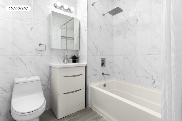 631 E 18th St Unit 2B, New York City, NY 11226 - full bathroom featuring shower / bath combo, vanity, and tile walls