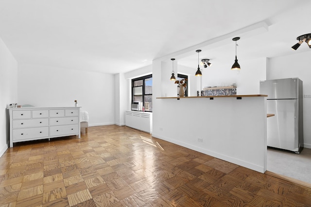 266 E Broadway Unit B-1902, New York City, NY 10002 - unfurnished living room with baseboards