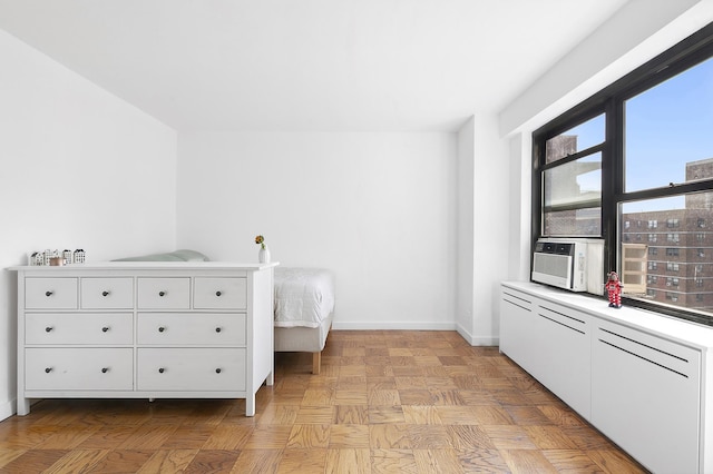 266 E Broadway Unit B-1902, New York City, NY 10002 - bedroom with baseboards and cooling unit