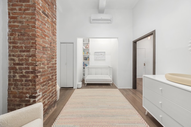 21 E 22nd St Unit 2B, New York City, NY 10010 - hall with a wall unit AC, dark wood-style flooring, beam ceiling, and a towering ceiling