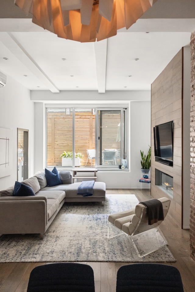 21 E 22nd St Unit 2B, New York City, NY 10010 - living area featuring hardwood / wood-style flooring, beamed ceiling, and a wall mounted air conditioner