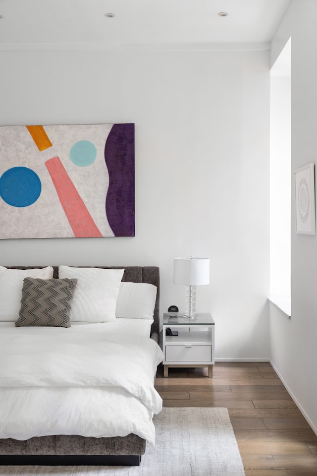 21 E 22nd St Unit 2B, New York City, NY 10010 - bedroom featuring wood finished floors and baseboards