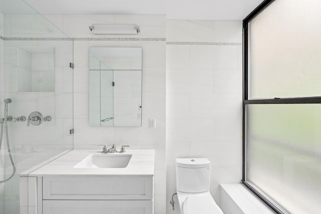 255 W 98th St Unit 5A, New York City, NY 10025 - bathroom with tile walls, vanity, and a shower with door