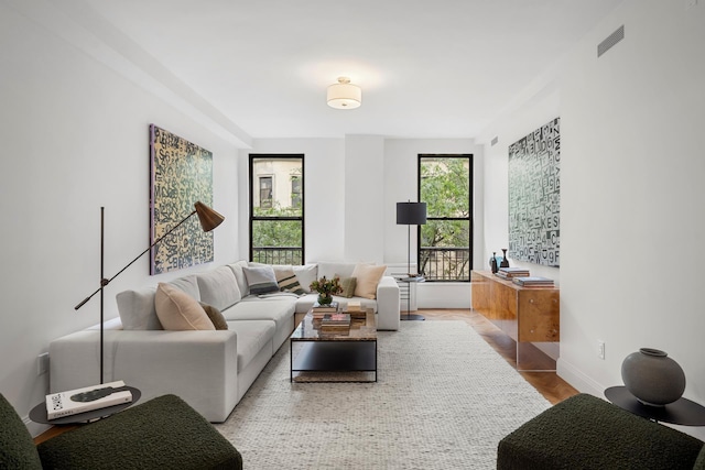 255 W 98th St Unit 5A, New York City, NY 10025 - living room featuring wood finished floors and baseboards