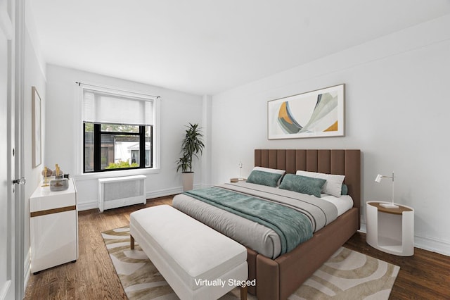 41 W 82nd St Unit 6-A, New York City, NY 10024 - bedroom with radiator heating unit and wood finished floors