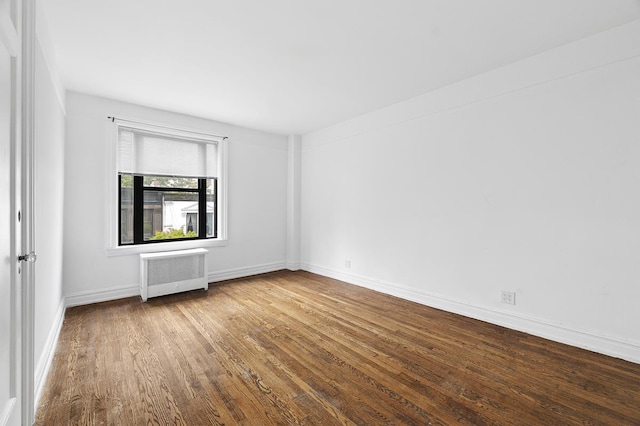 41 W 82nd St Unit 6-A, New York City, NY 10024 - spare room featuring radiator and wood finished floors