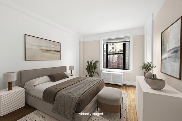 41 W 82nd St Unit 6-A, New York City, NY 10024 - bedroom with radiator and wood finished floors