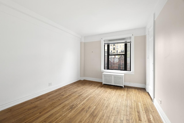 41 W 82nd St Unit 6-A, New York City, NY 10024 - spare room with radiator and light wood-style flooring