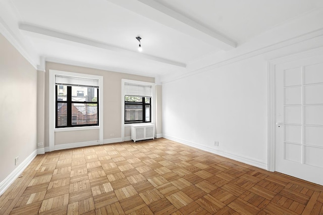 41 W 82nd St Unit 6-A, New York City, NY 10024 - empty room with radiator heating unit and beam ceiling
