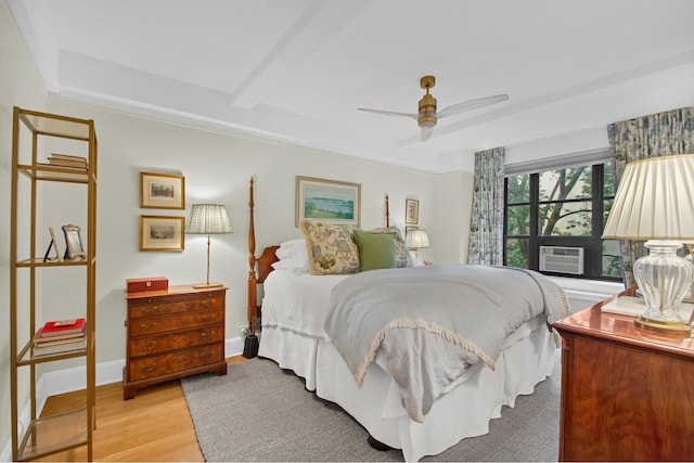 235 E 22nd St Unit 5C, New York City, NY 10010 - bedroom with cooling unit, light wood finished floors, a raised ceiling, and a ceiling fan