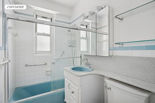 2400 Johnson Ave Unit 1K, New York City, NY 10463 - full bath with vanity, shower / bath combination with glass door, and backsplash