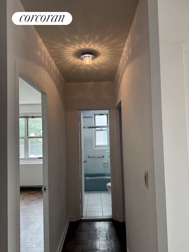 2400 Johnson Ave Unit 1K, New York City, NY 10463 - corridor featuring a textured ceiling