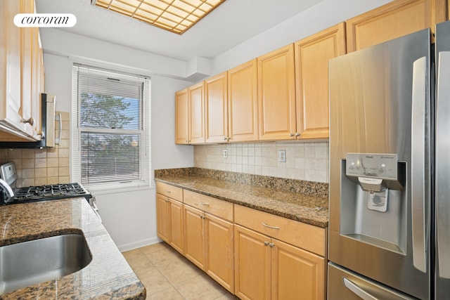 2400 Johnson Ave Unit 1K, New York City, NY 10463 - kitchen with stainless steel refrigerator with ice dispenser, gas range oven, light tile patterned floors, stone countertops, and light brown cabinets
