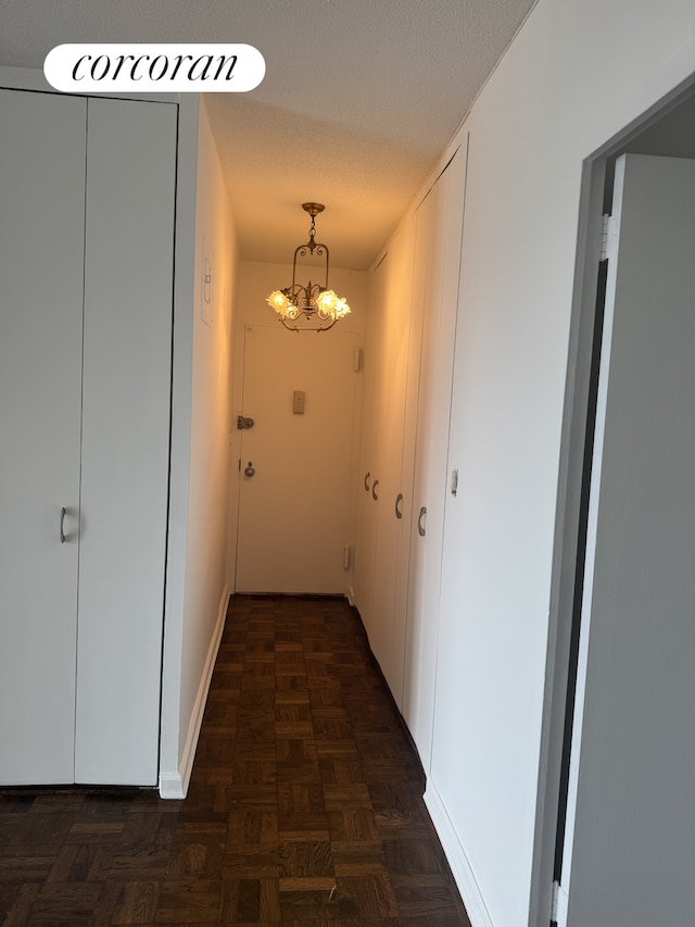 2400 Johnson Ave Unit 1K, New York City, NY 10463 - corridor with a chandelier and baseboards