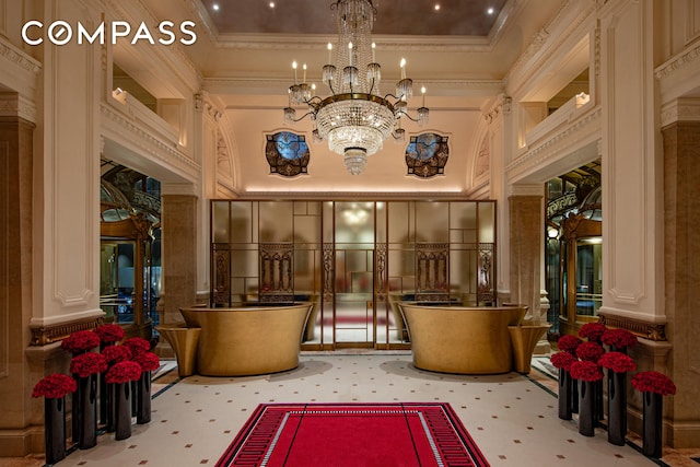 2 E 55th St Unit 1116, New York City, NY 10022 - community lobby with a decorative wall, ornamental molding, and a towering ceiling