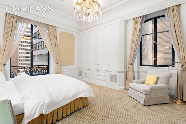 2 E 55th St Unit 1116, New York City, NY 10022 - bedroom featuring carpet floors, a chandelier, multiple windows, and ornamental molding