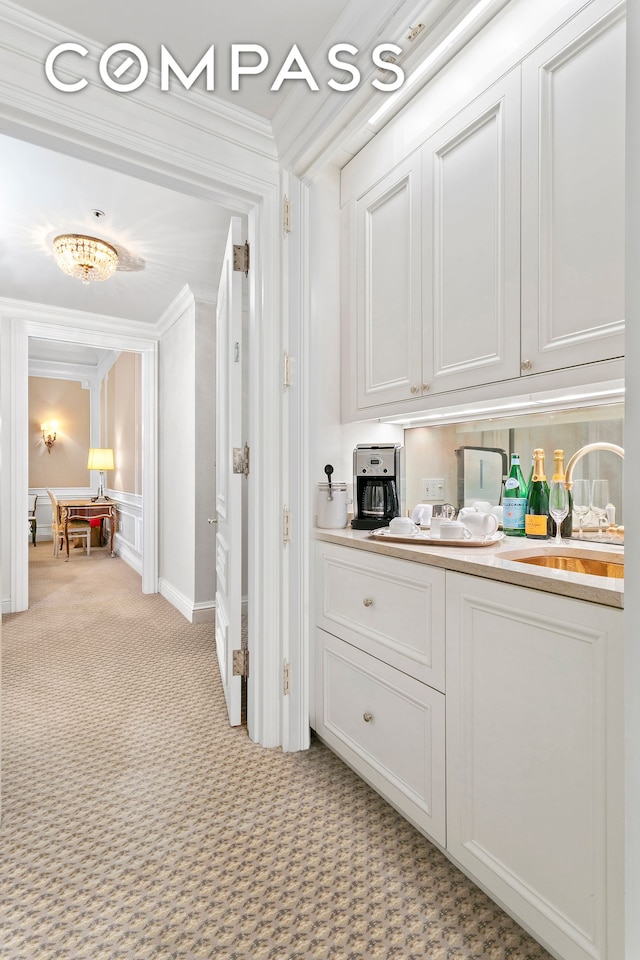 2 E 55th St Unit 1116, New York City, NY 10022 - hall with ornamental molding and light carpet