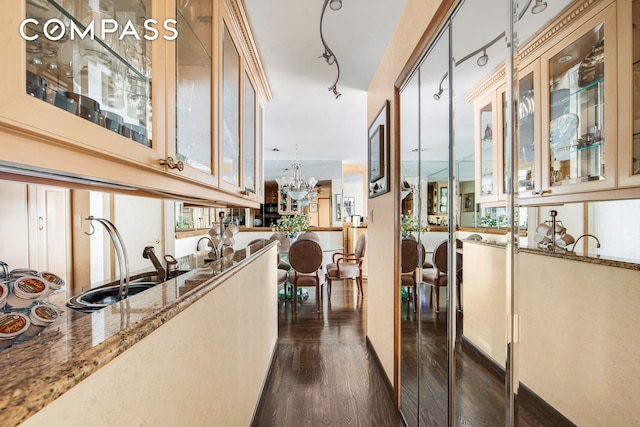 400 E 85th St Unit 15F, New York City, NY 10028 - hall with dark wood-style floors, a chandelier, and rail lighting
