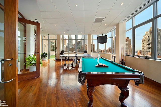 30 W 63rd St Unit 8T, New York City, NY 10023 - game room featuring healthy amount of natural light, wood finished floors, billiards table, floor to ceiling windows, and recessed lighting