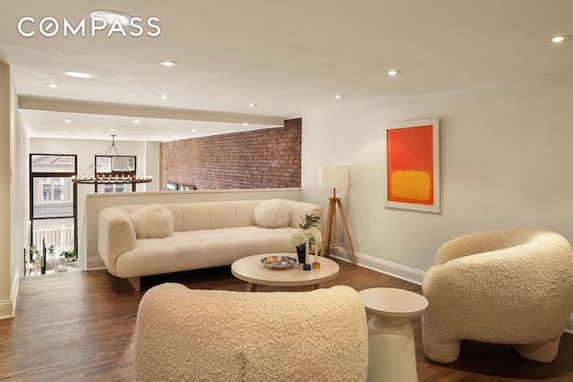 250 Mercer St Unit C302, New York City, NY 10012 - living room featuring dark wood-type flooring, recessed lighting, and a chandelier