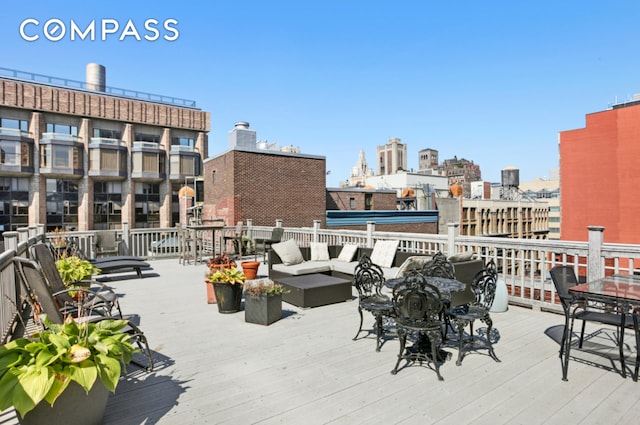 250 Mercer St Unit C302, New York City, NY 10012 - wooden deck with an outdoor hangout area and a city view