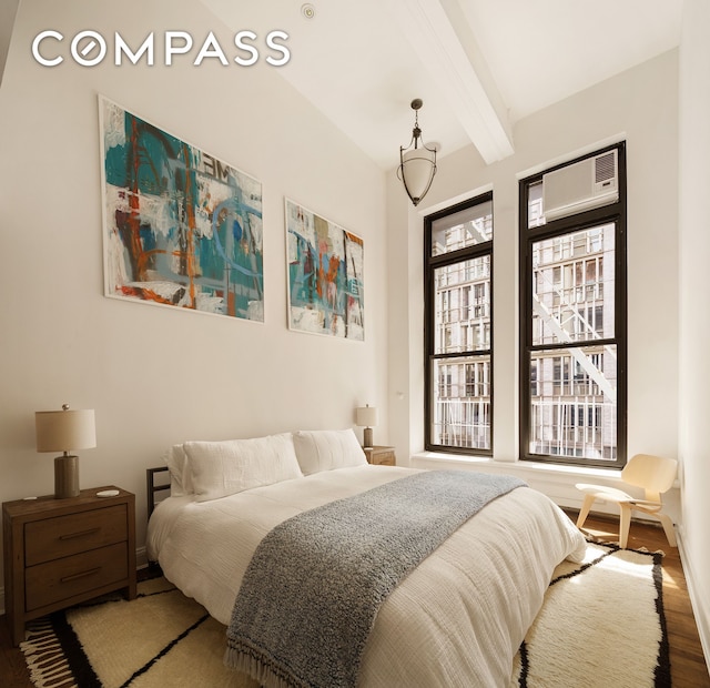 250 Mercer St Unit C302, New York City, NY 10012 - bedroom featuring beam ceiling and wood finished floors