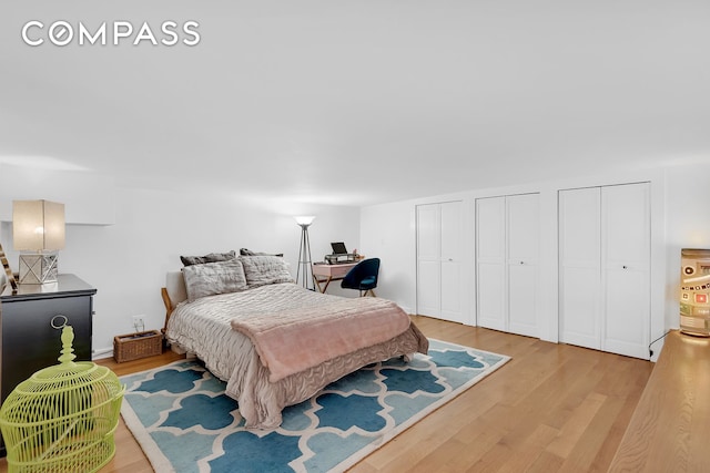 41 E 19th St Unit 1B, New York City, NY 10003 - bedroom featuring wood finished floors, two closets, and an office area