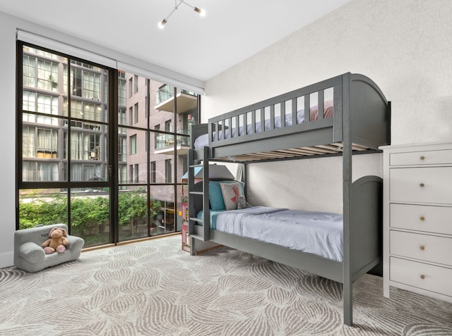22-18 Jackson Ave Unit 208, New York City, NY 11101 - carpeted bedroom with expansive windows